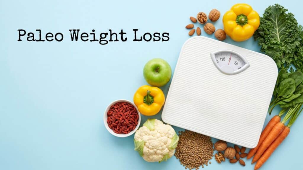 Paleo weight loss concept with healthy vegetables, nuts, and a weighing scale representing clean eating and natural fat loss goals.