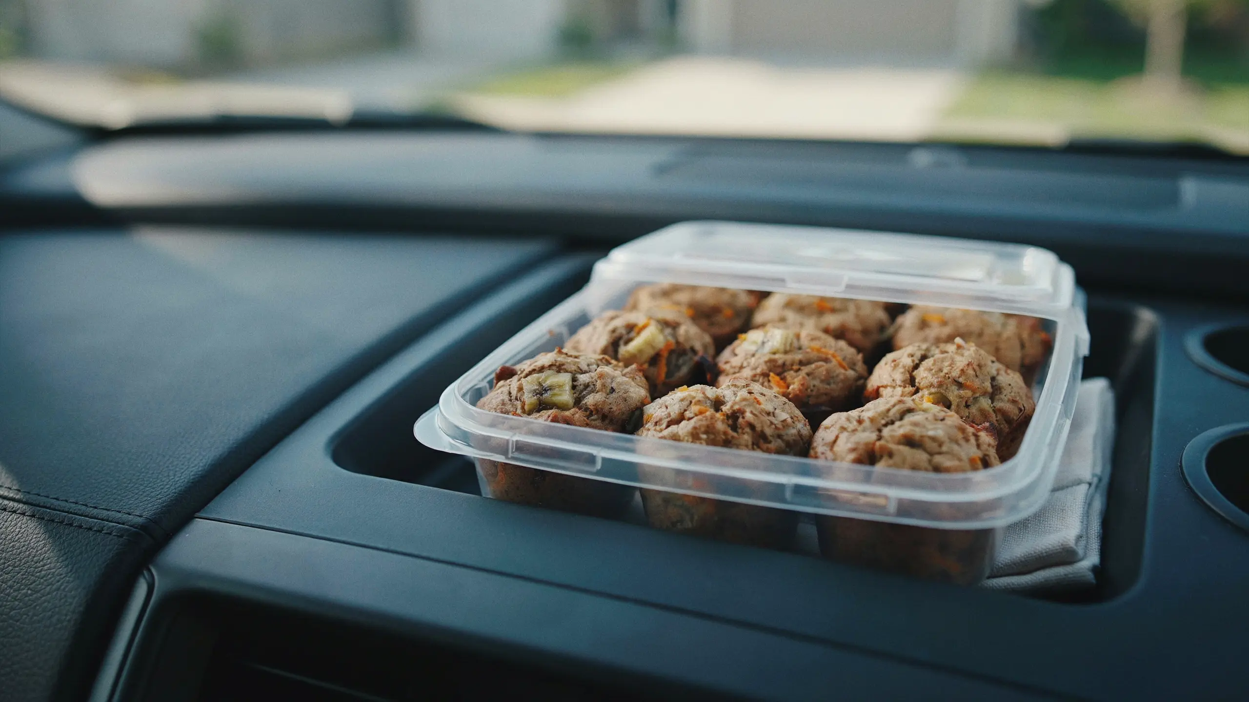 Homemade whole wheat mini muffins packed as a healthy road trip snack.