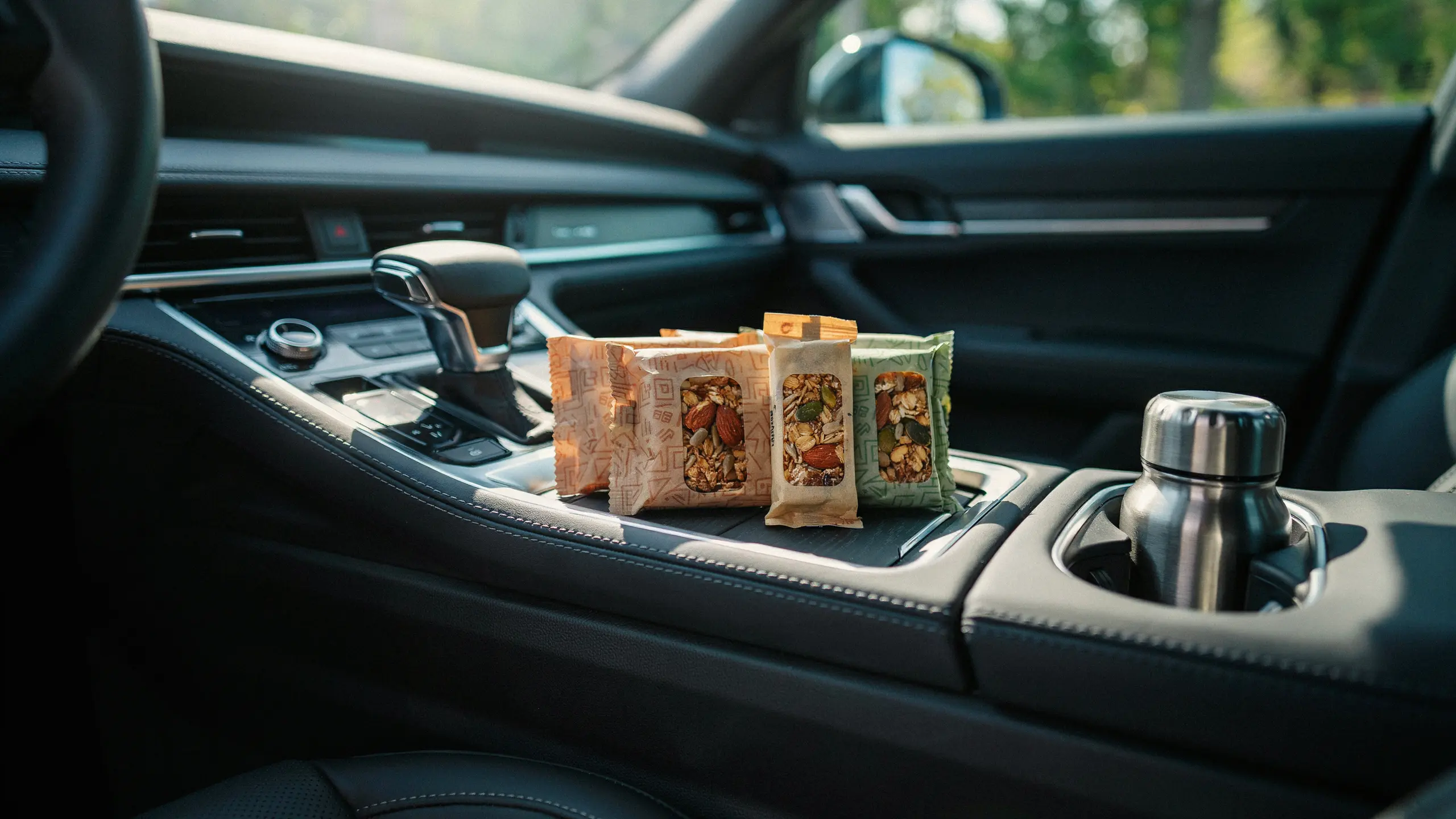 Low-sugar granola bars packed for a healthy road trip snack.