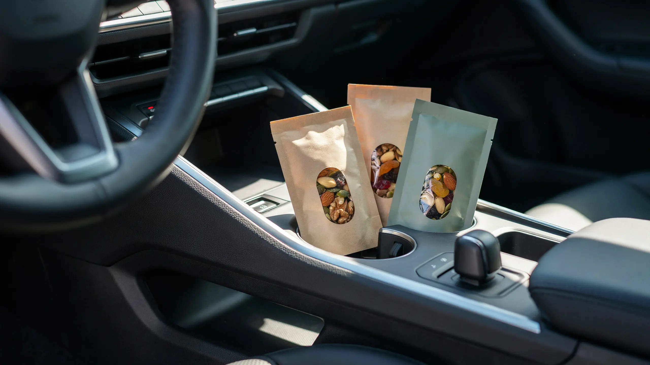 Packaged trail mix with nuts and dried fruit for a healthy road trip snack.
