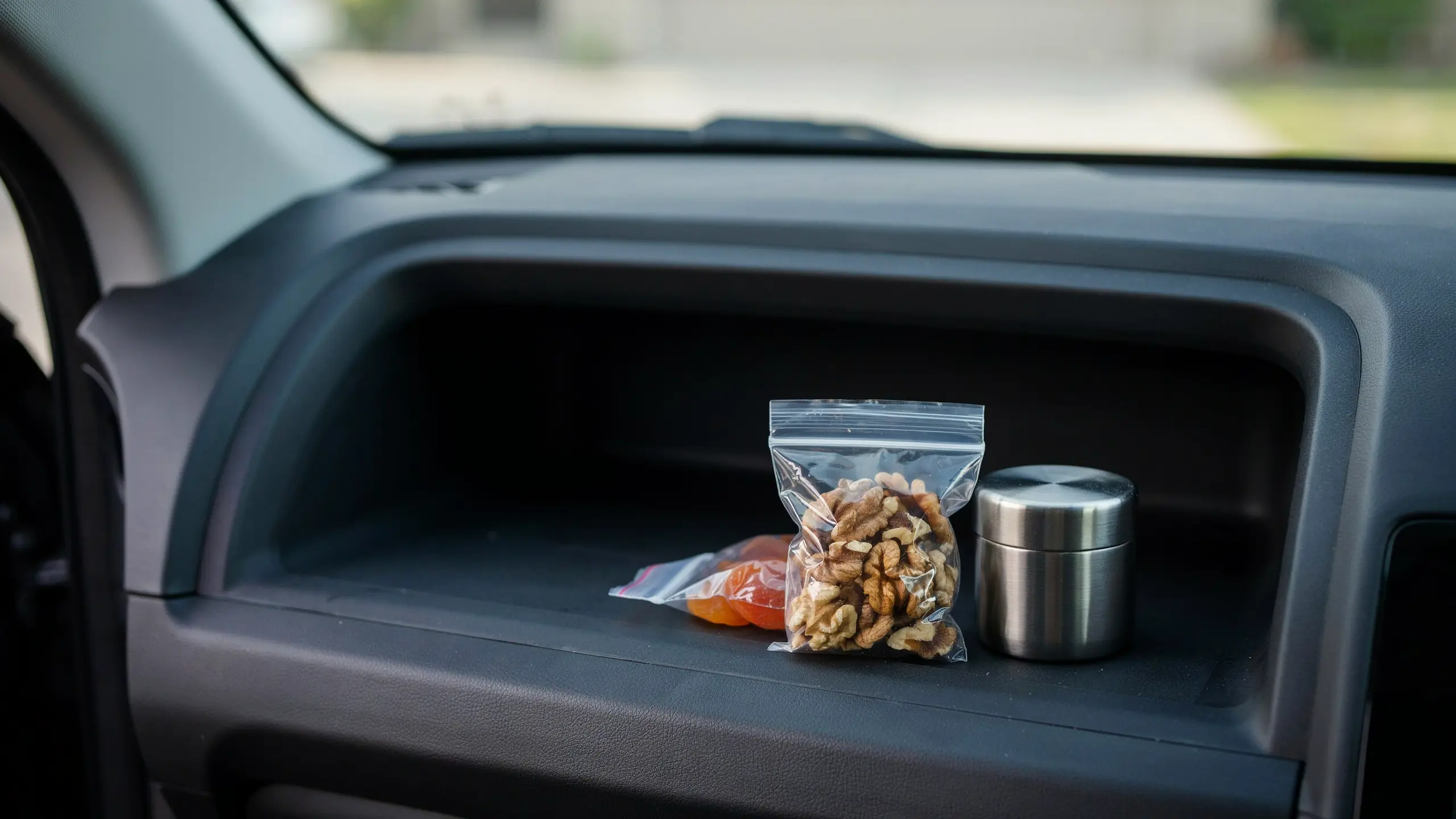 Portioned walnuts with dried fruit packed as a healthy road trip snack.