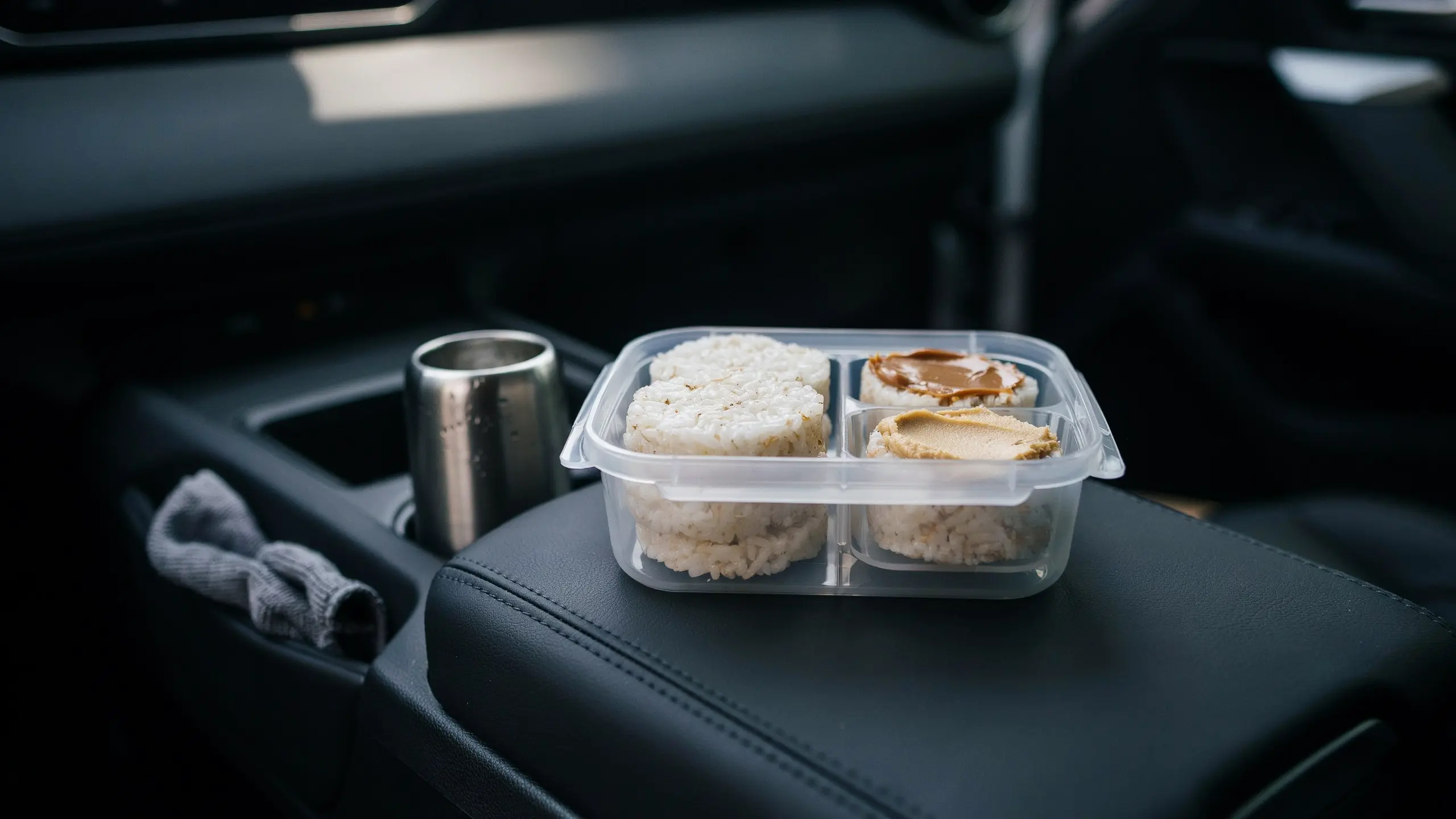 Rice cakes stored in a hard container as a light road trip snack.
